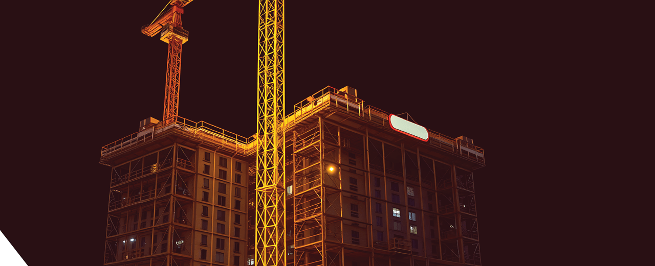 High-rise construction site illuminated at night – Arabian Valley project